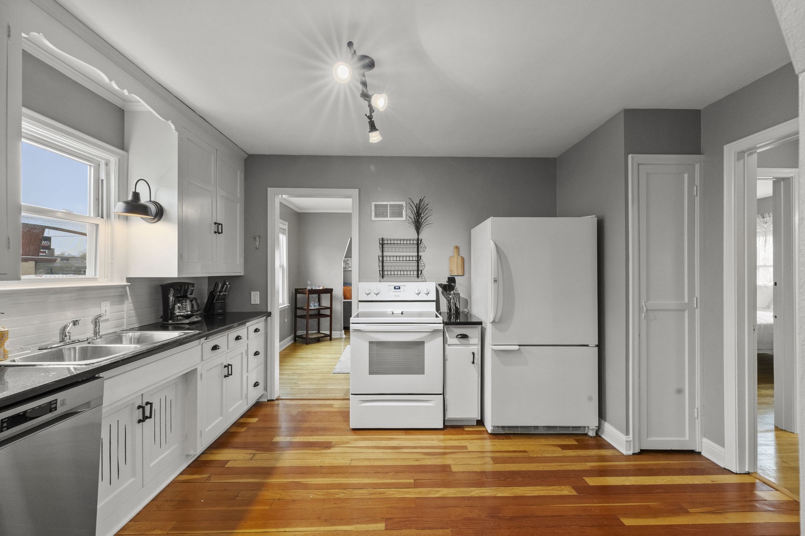 Your fully-equipped kitchen features sleek countertops, modern appliances, and plenty of storage space—perfect for preparing family meals or morning coffee before exploring the area.