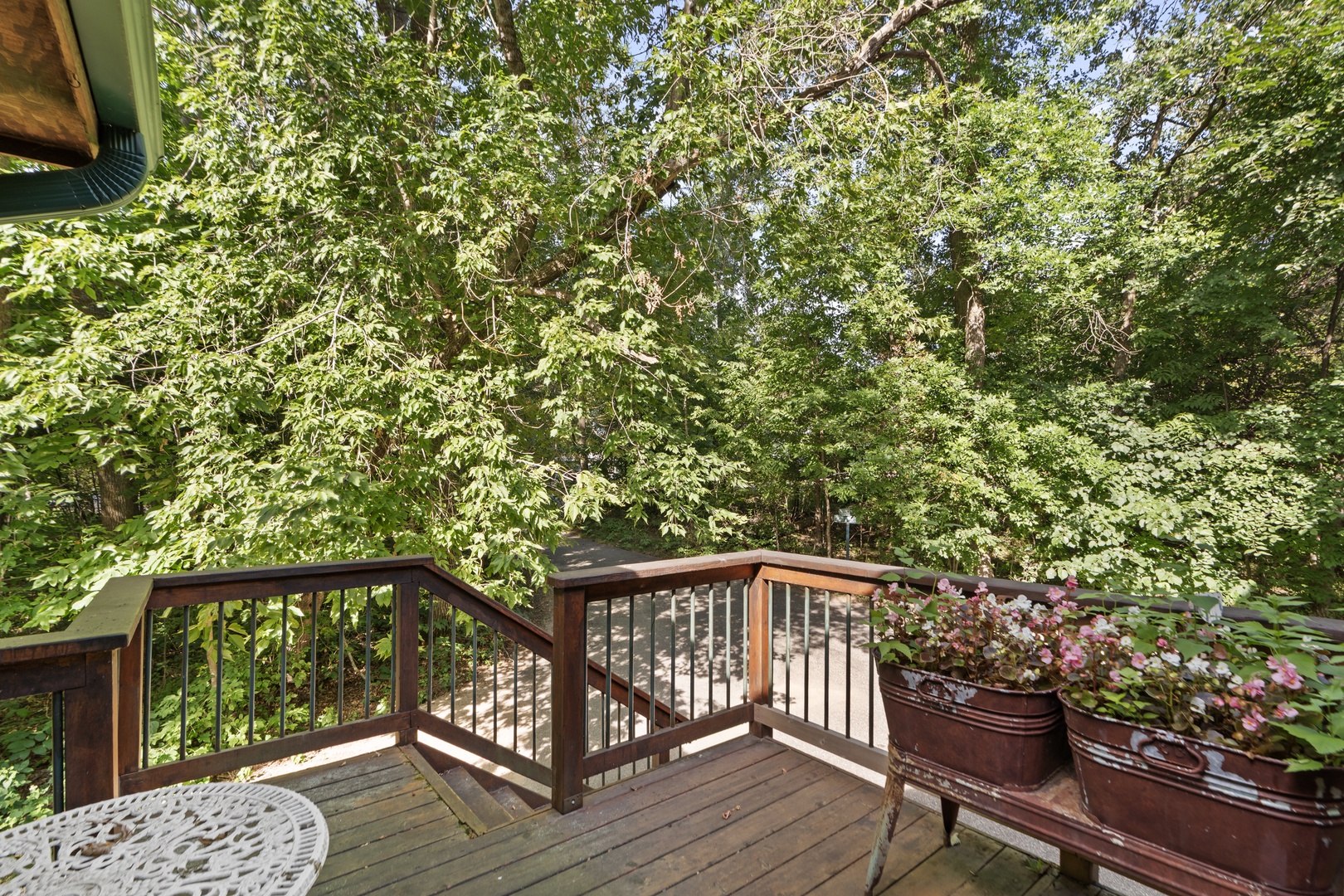 Step onto your private balcony and breathe in the fresh forest air, surrounded by towering trees that create a peaceful, natural canopy. It's your own secluded retreat.