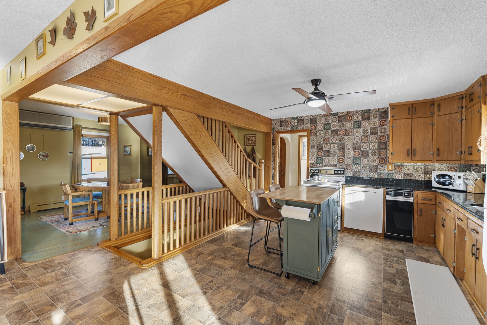 Warm wooden beams and rustic charm create your perfect cooking space, where morning coffee and family meals become cherished memories.