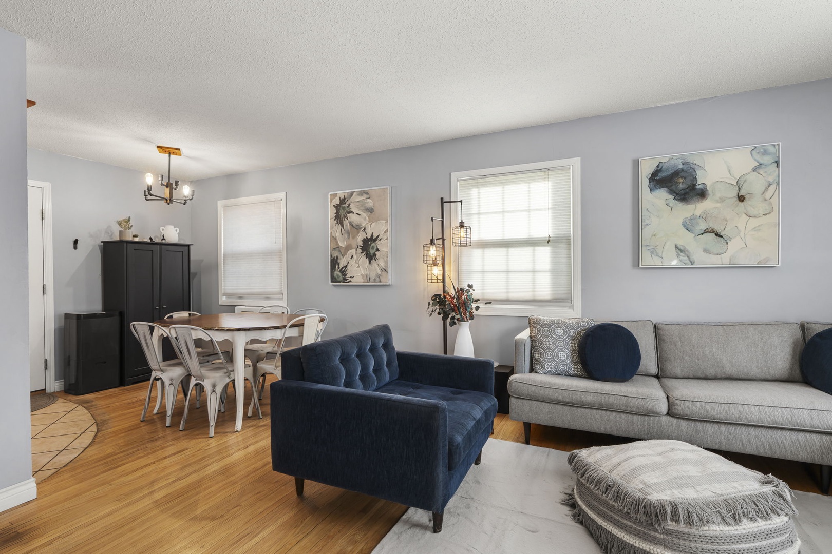 Relax in your spacious living area with plush seating and natural light, then gather around the dining table for memorable meals together.