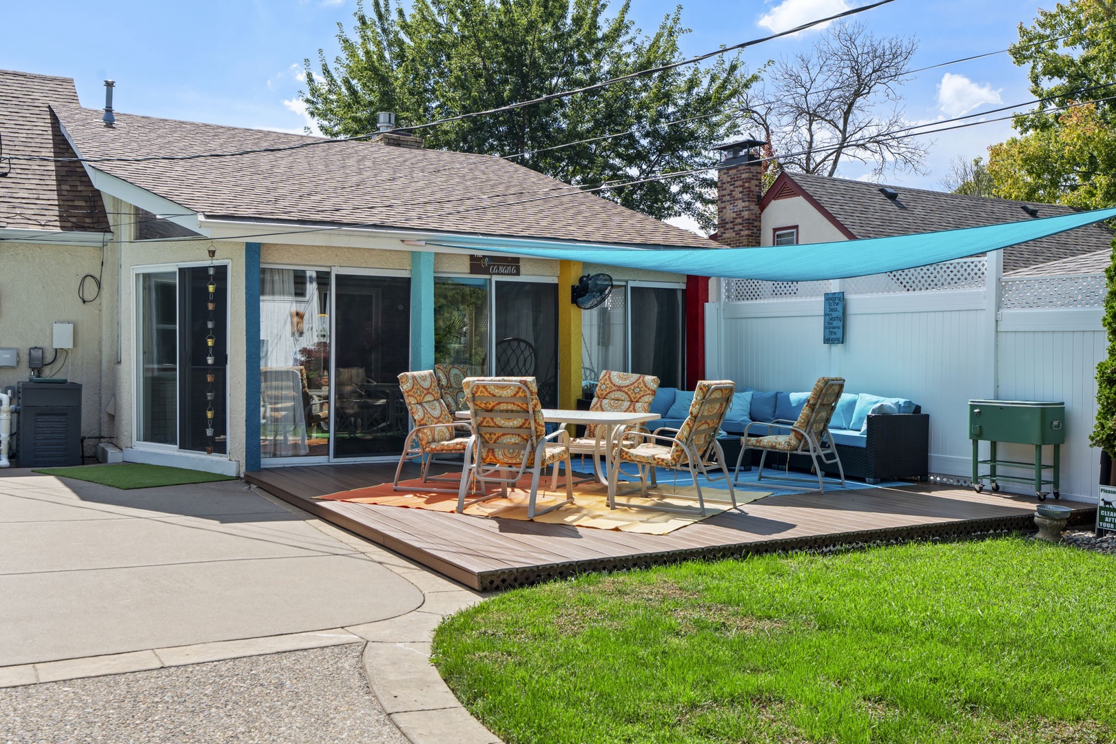Relax on your private deck with turquoise shade sail and comfy seating, perfect for outdoor dining and unwinding in style.