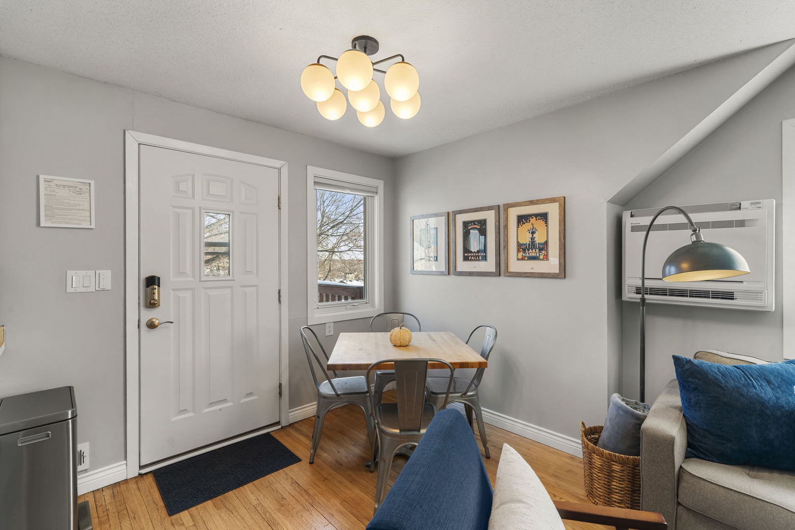 Settle into your cozy dining nook where warm wood floors and soft lighting create the perfect spot for morning coffee or evening meals.