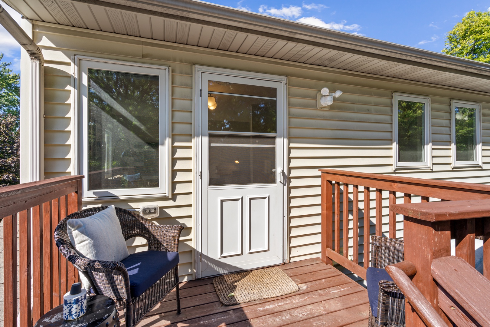 Relax on your private deck with comfortable wicker seating, where you can sip your morning coffee and enjoy peaceful moments outdoors.