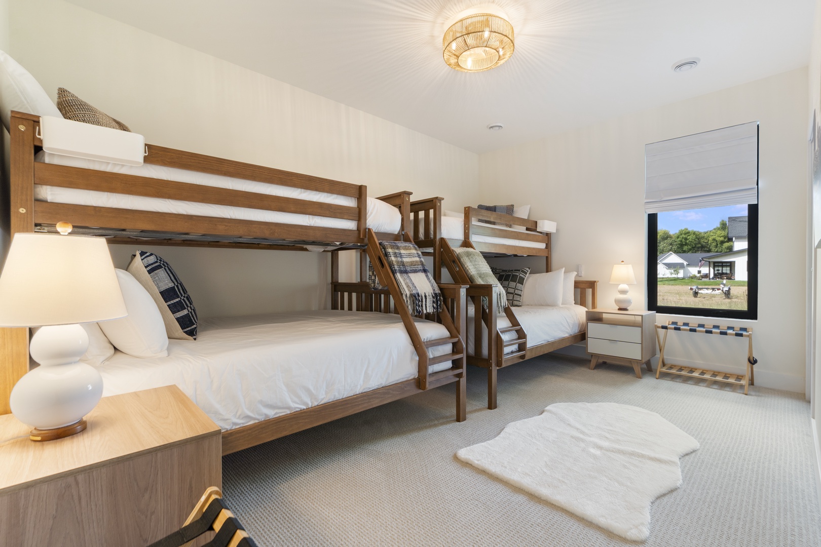 Your group will sleep comfortably in this bright bedroom featuring sturdy bunk beds and plenty of natural light streaming through the window, perfect for families or friends traveling together.