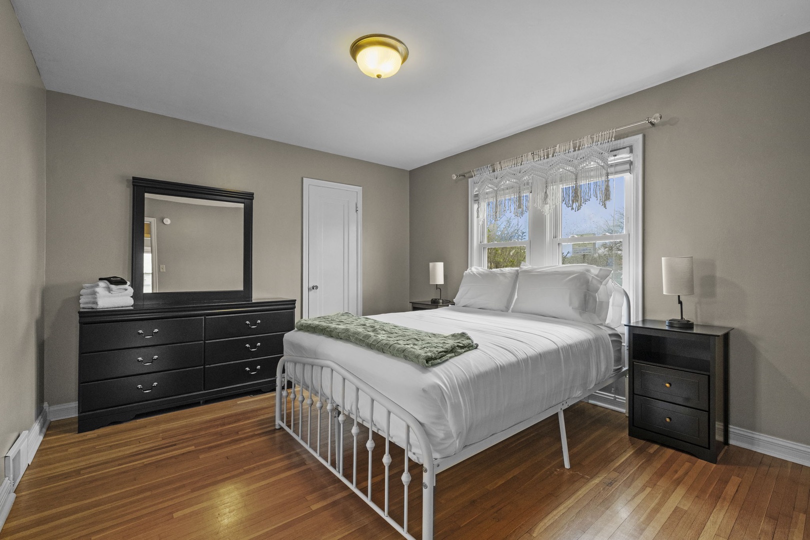 Slip into crisp white linens and rest easy in your quiet, light-filled bedroom. Warm wood floors and elegant furnishings create a peaceful retreat where you can unwind after a day of exploring.