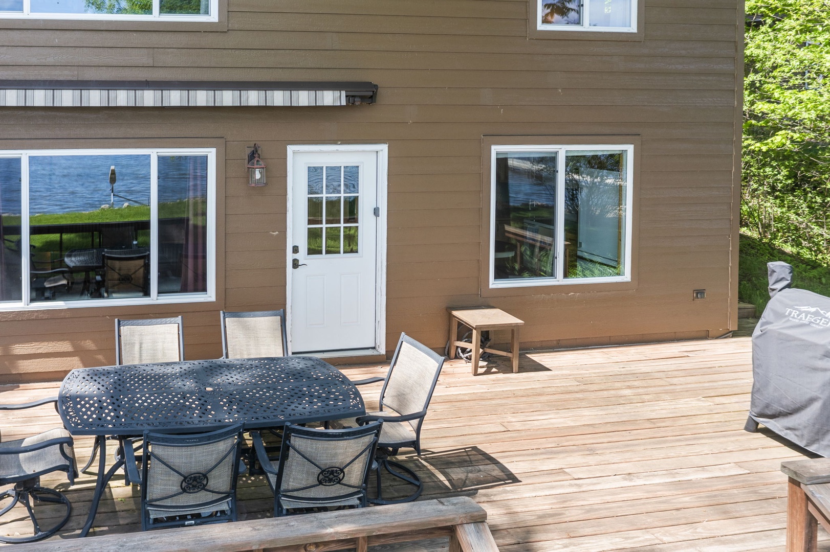 This spacious lakeside deck is perfect for your morning coffee or evening dinners under the stars, with plenty of seating and easy access to the water just steps away.