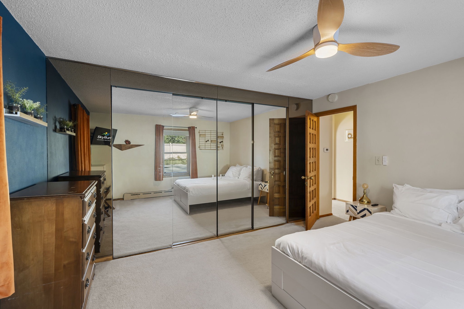 Relax in your spacious bedroom with mirrored wardrobes and modern ceiling fan keeping you comfortable.