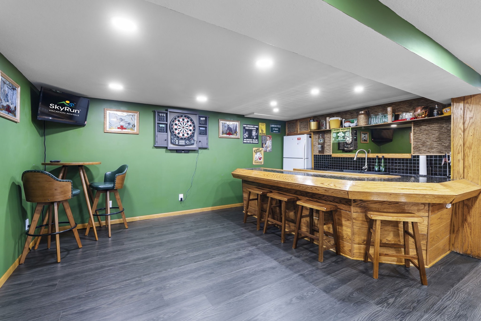 Your own private sports bar awaits with a dartboard and cozy seating perfect for game nights.