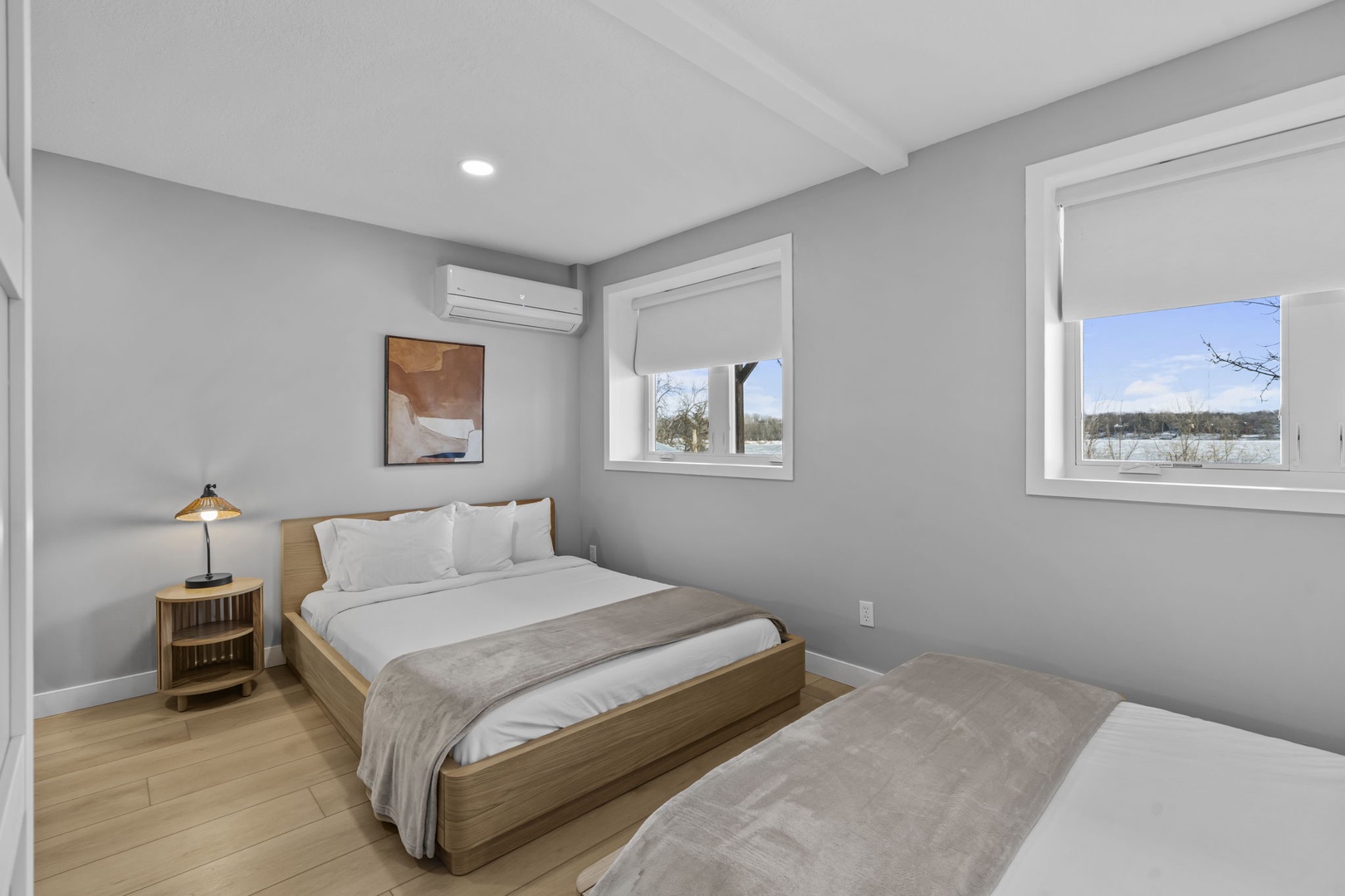 Drift off peacefully in your serene bedroom with crisp linens and natural light streaming through windows overlooking scenic views.