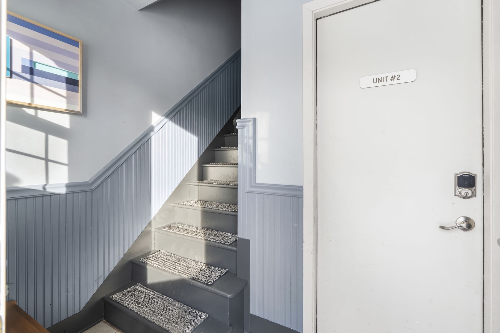 Entrance to Unit 2 is on the ground floor of this updated duplex.