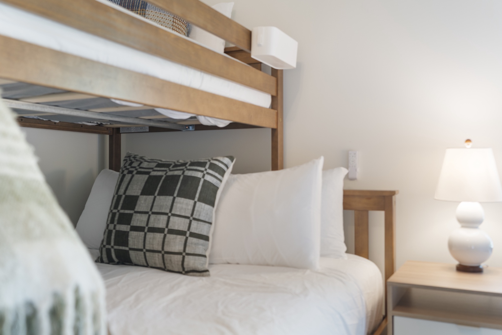 Sink into crisp, plush linens and unwind in your peaceful retreat, with a space-saving bunk ready for extra guests.