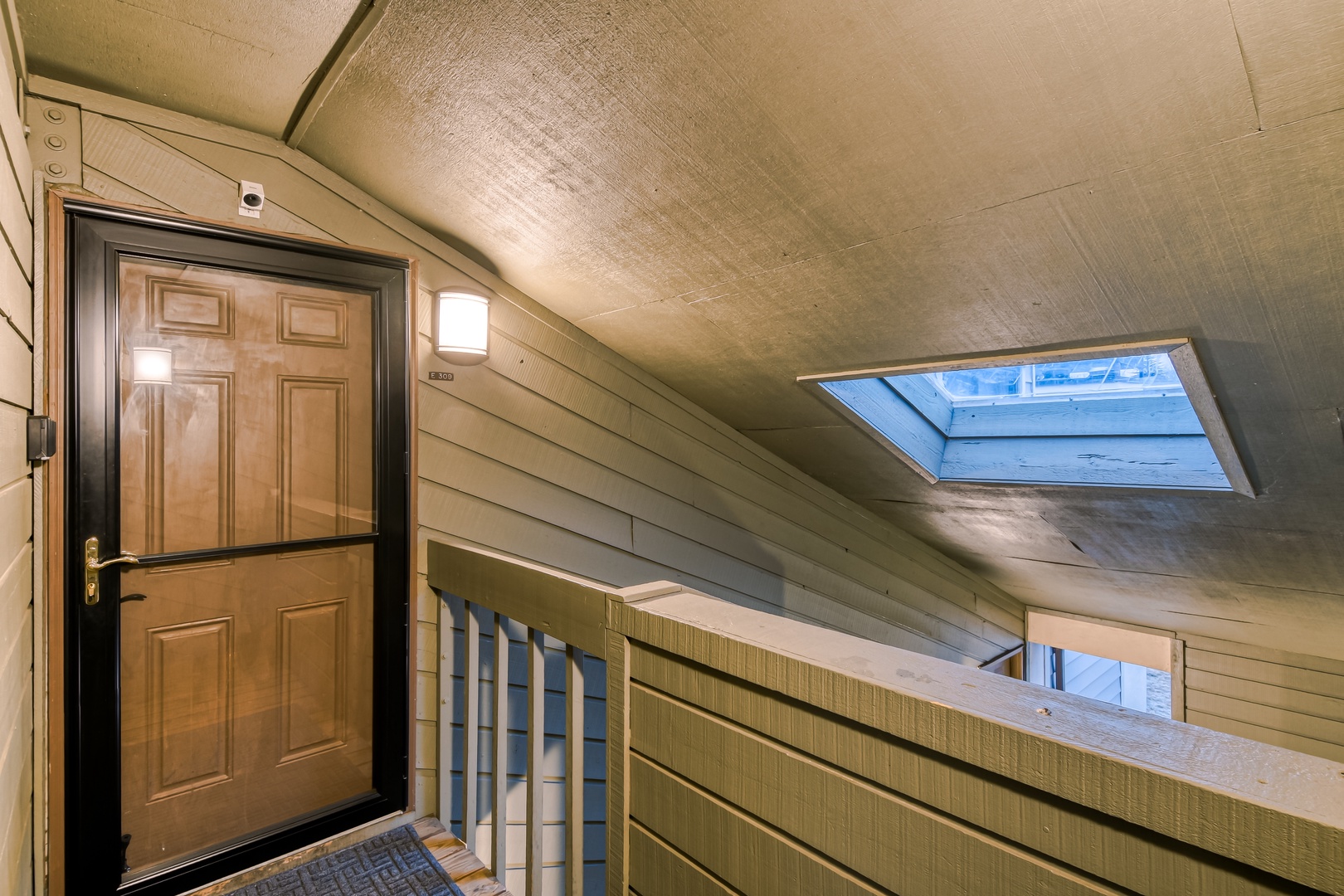 Your skylight fills this cozy attic entrance with natural light