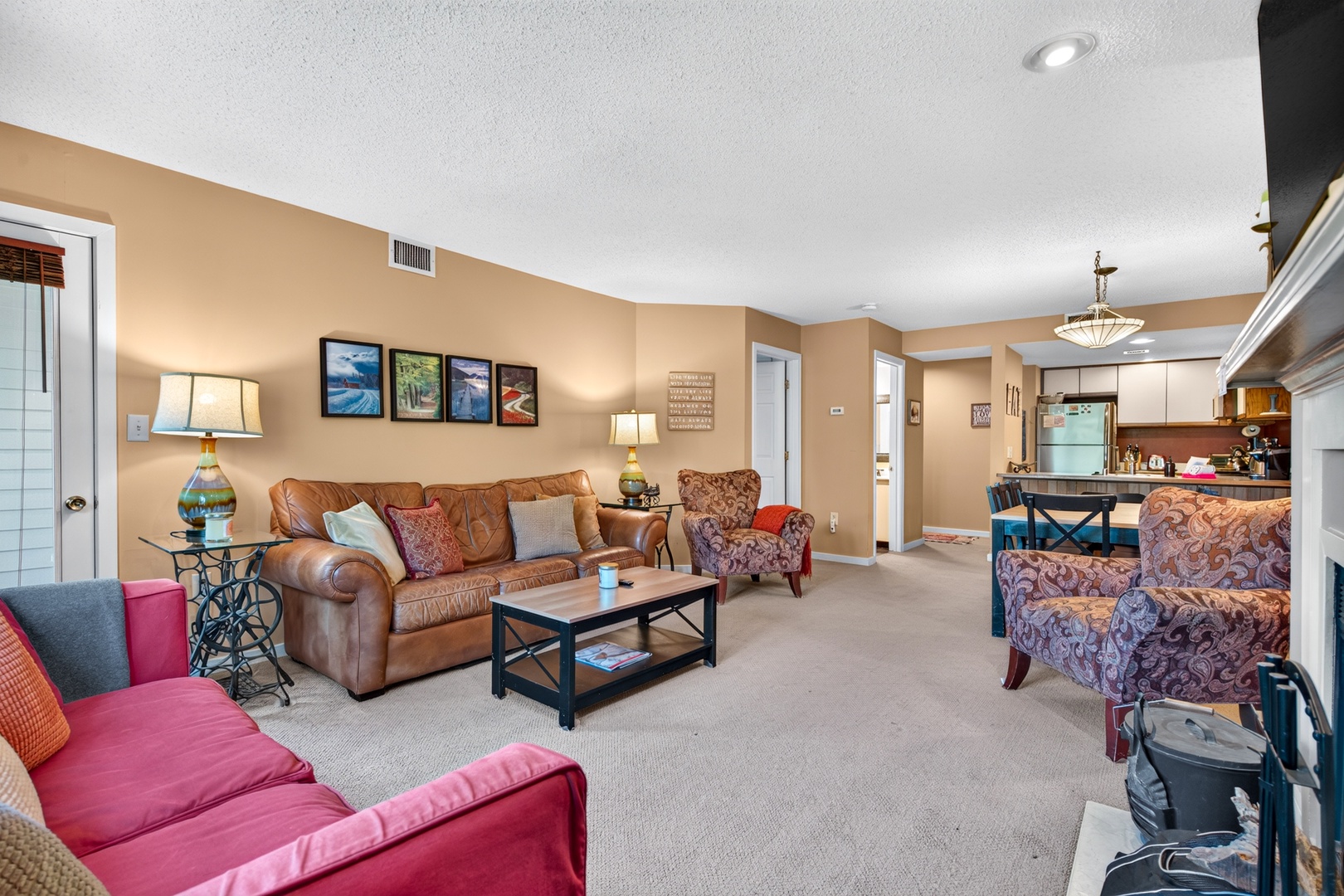 Stretch out in your spacious living area with plush seating for everyone and open flow into the dining and kitchen. Perfect for unwinding after a day exploring or gathering with your favorite people.