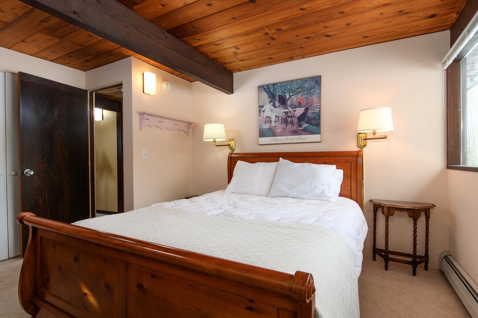 Cozy lower-level bedroom with a queen bed—perfect for relaxing and recharging.
