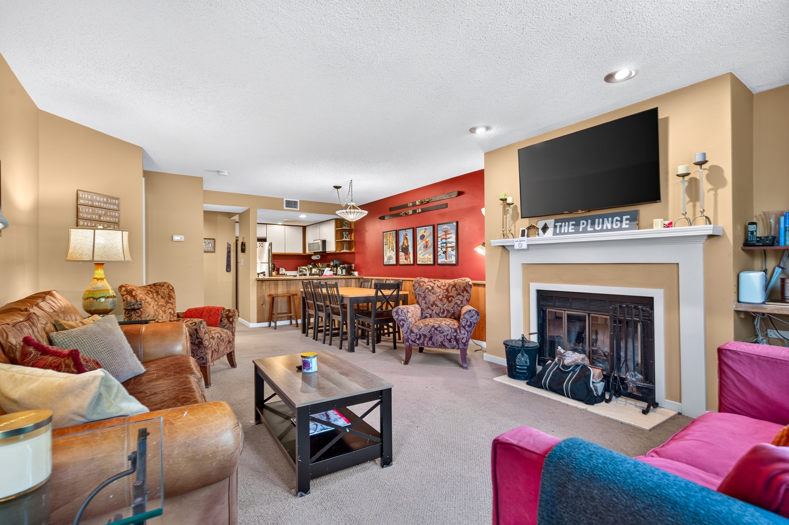 Gather around the cozy fireplace in your spacious living area, perfect for sharing stories and creating memories with friends and family after a day of adventure.