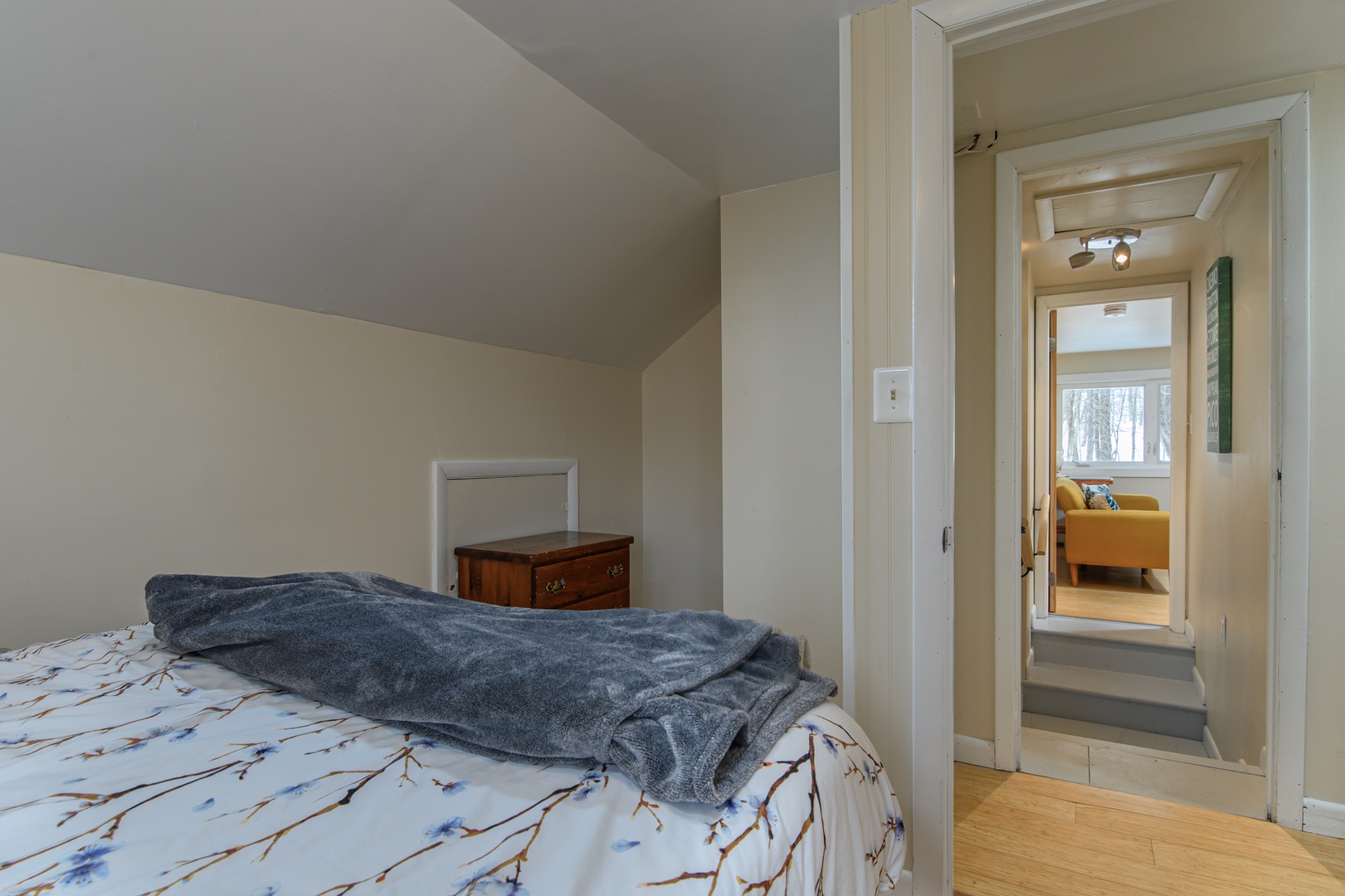A welcoming 3rd floor bedroom with a queen bed, designed for comfort and a calm, restful night away from it all.