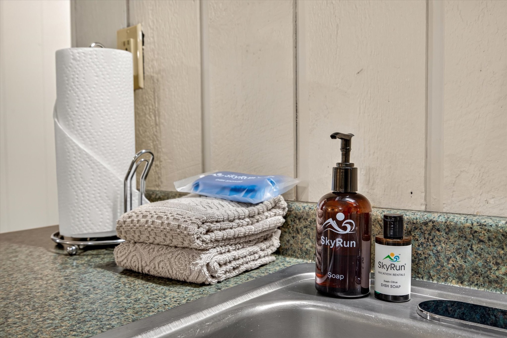 Fresh towels and quality toiletries await you at the sink, ensuring comfort throughout your stay.