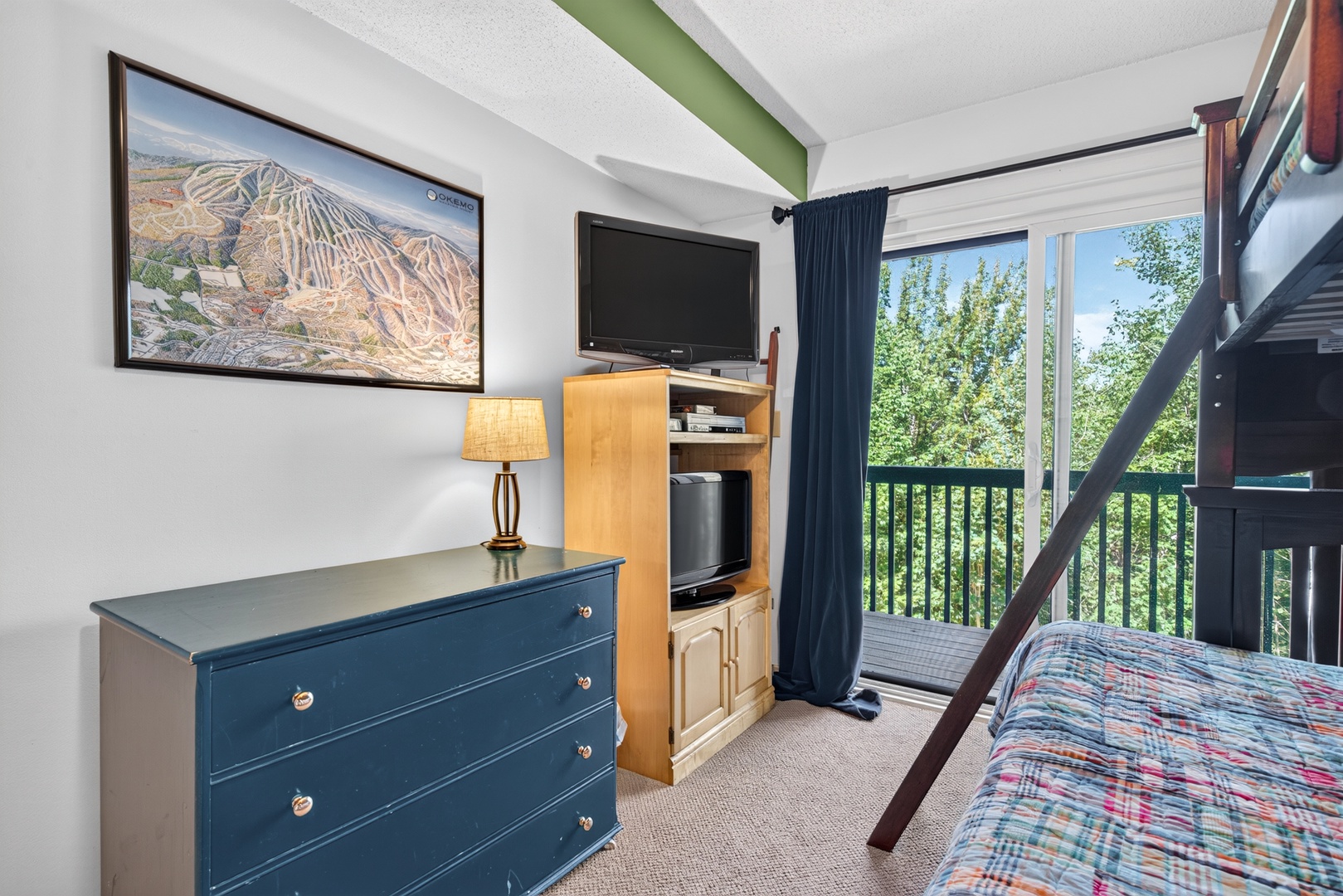 Wake up to leafy treetops just outside your window. This cozy room offers bunk beds, handy storage, and mountain views to set the tone for your adventure-filled days ahead.