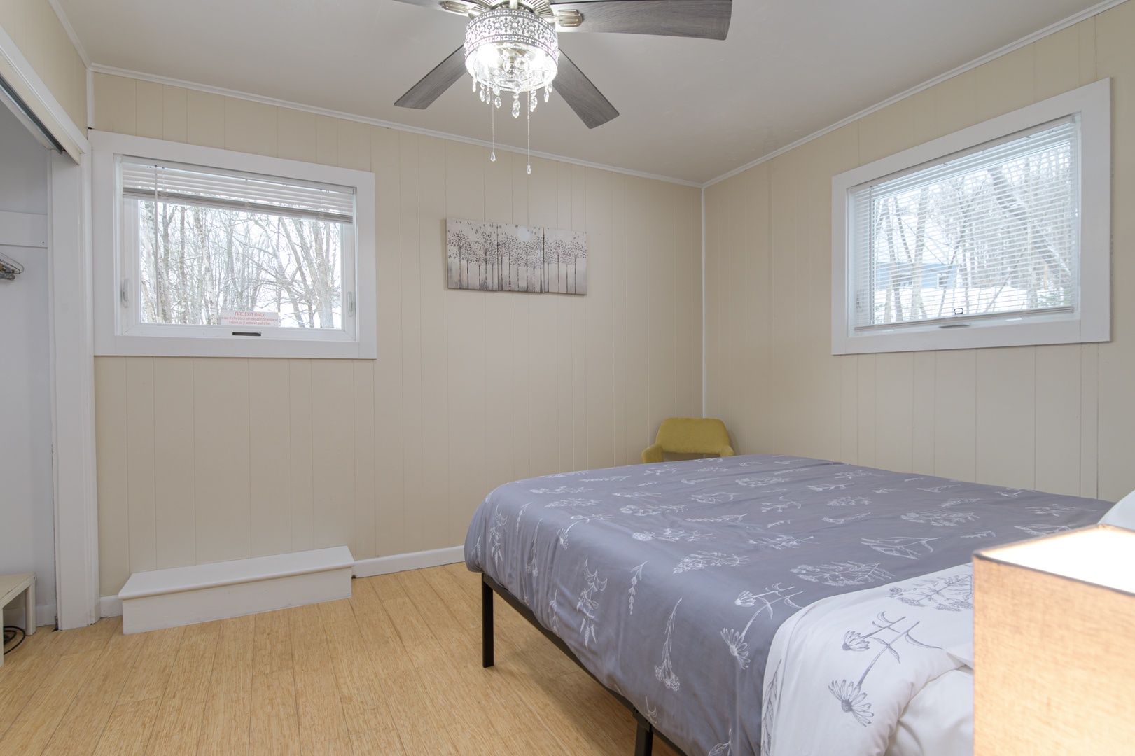 Main-floor bedroom with a queen bed—comfortable, bright, and ready for your stay.