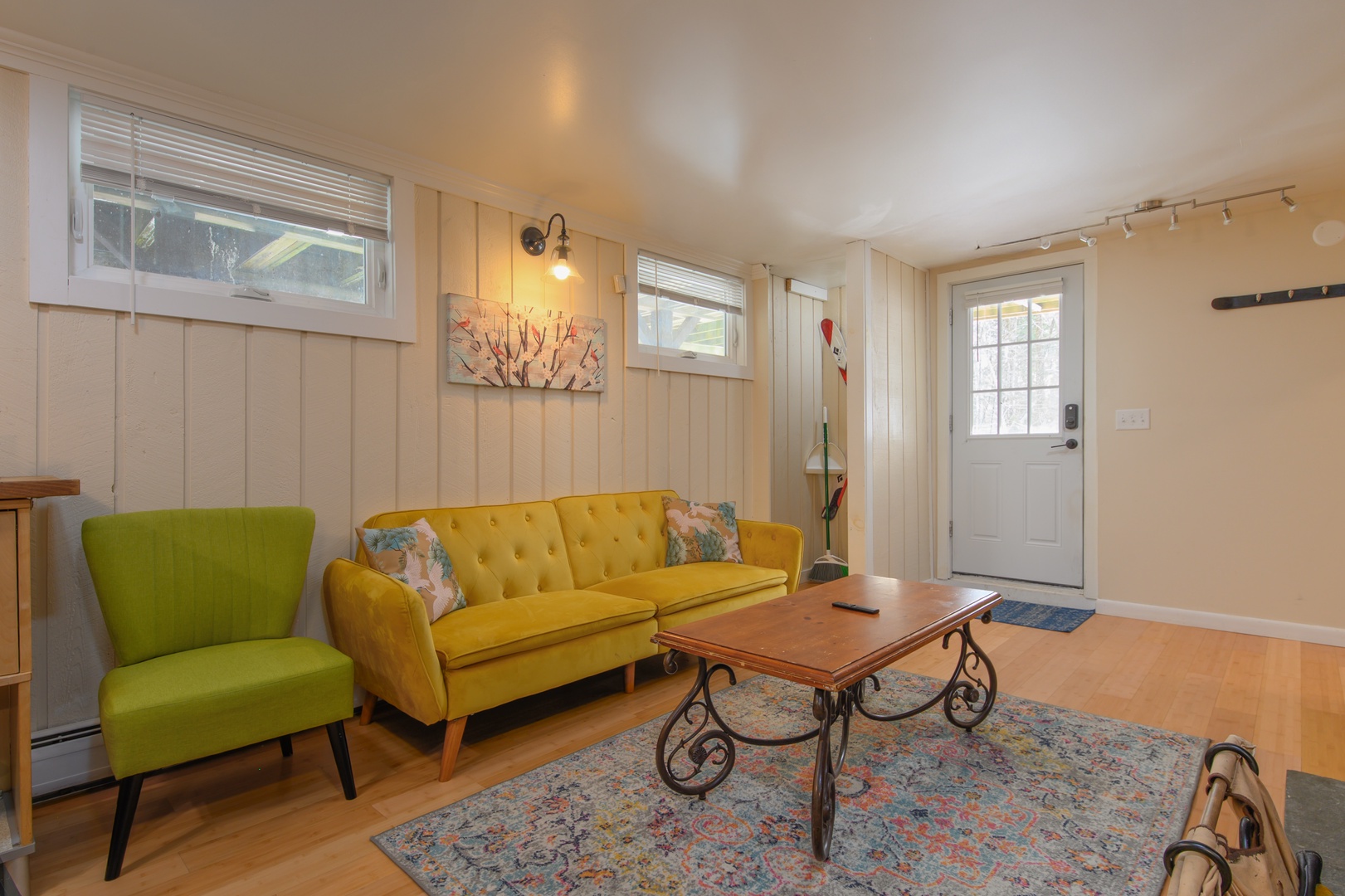 Gather around the fireplace, watch your favorite shows on the TV, or relax on the sofa and chair in this inviting living space.