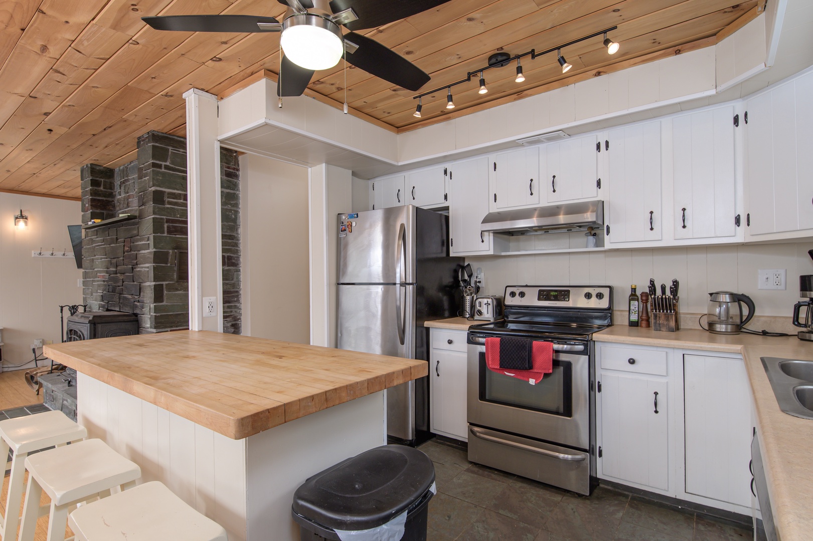 Whip up your favorite dishes in the fully equipped kitchen with a butcher-block island, perfect for gathering over meals.
