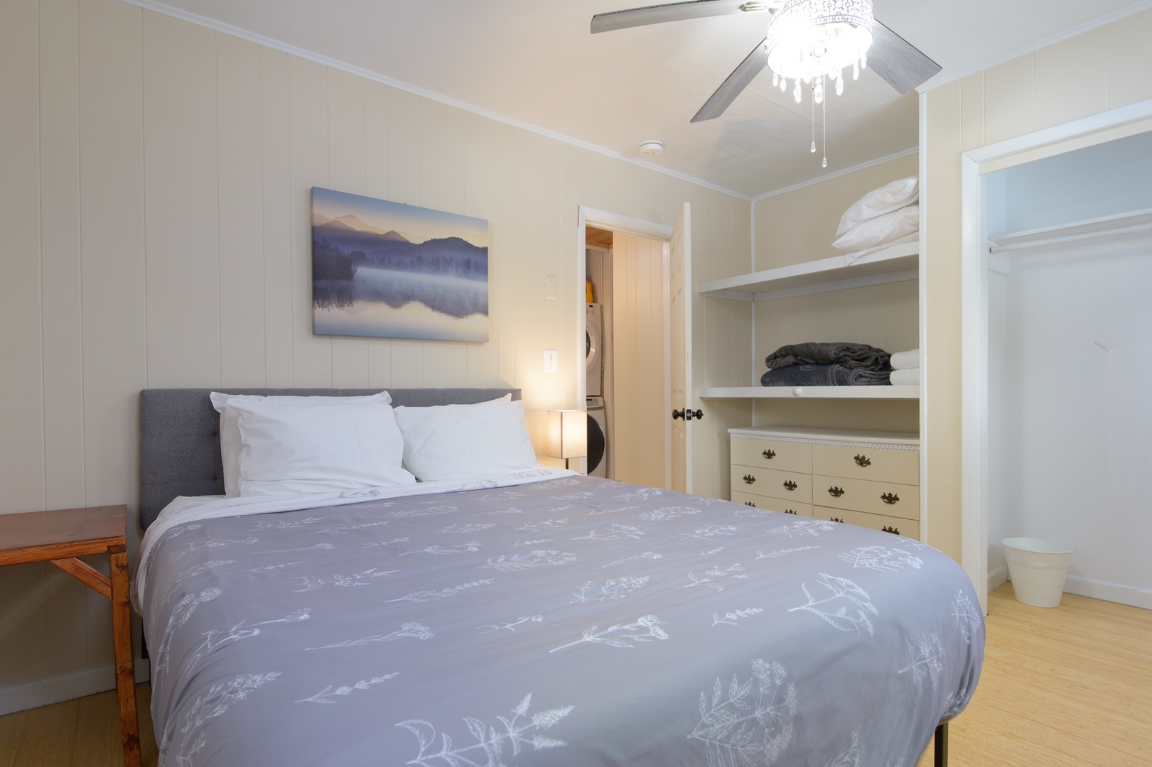 Your cozy bedroom features a comfortable bed, built-in storage, and elegant ceiling fan to keep you cool during restful nights.