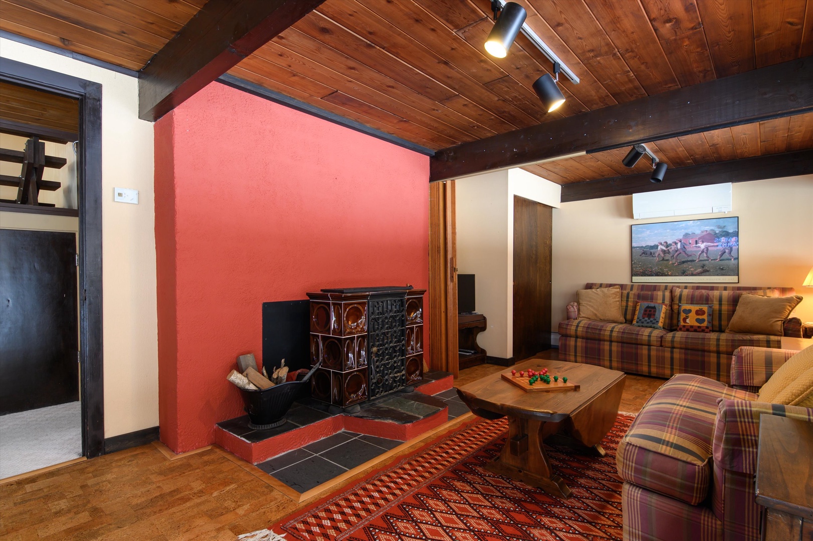 Hang out in this basement retreat with bar, seating, flat-screen TV, and decorative fireplace - ideal for entertaining.