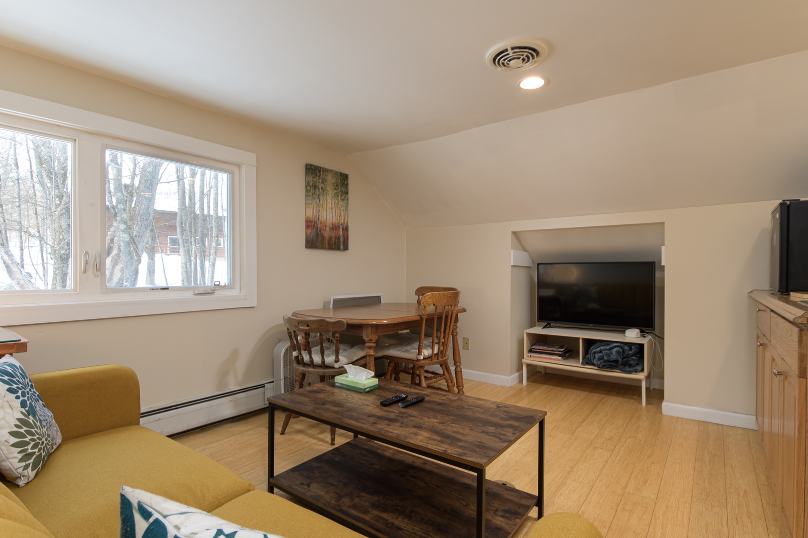 A bonus upstairs living space with a TV, table, and sink—ideal for spreading out, late-night laughs, or a quiet retreat from the main living area.