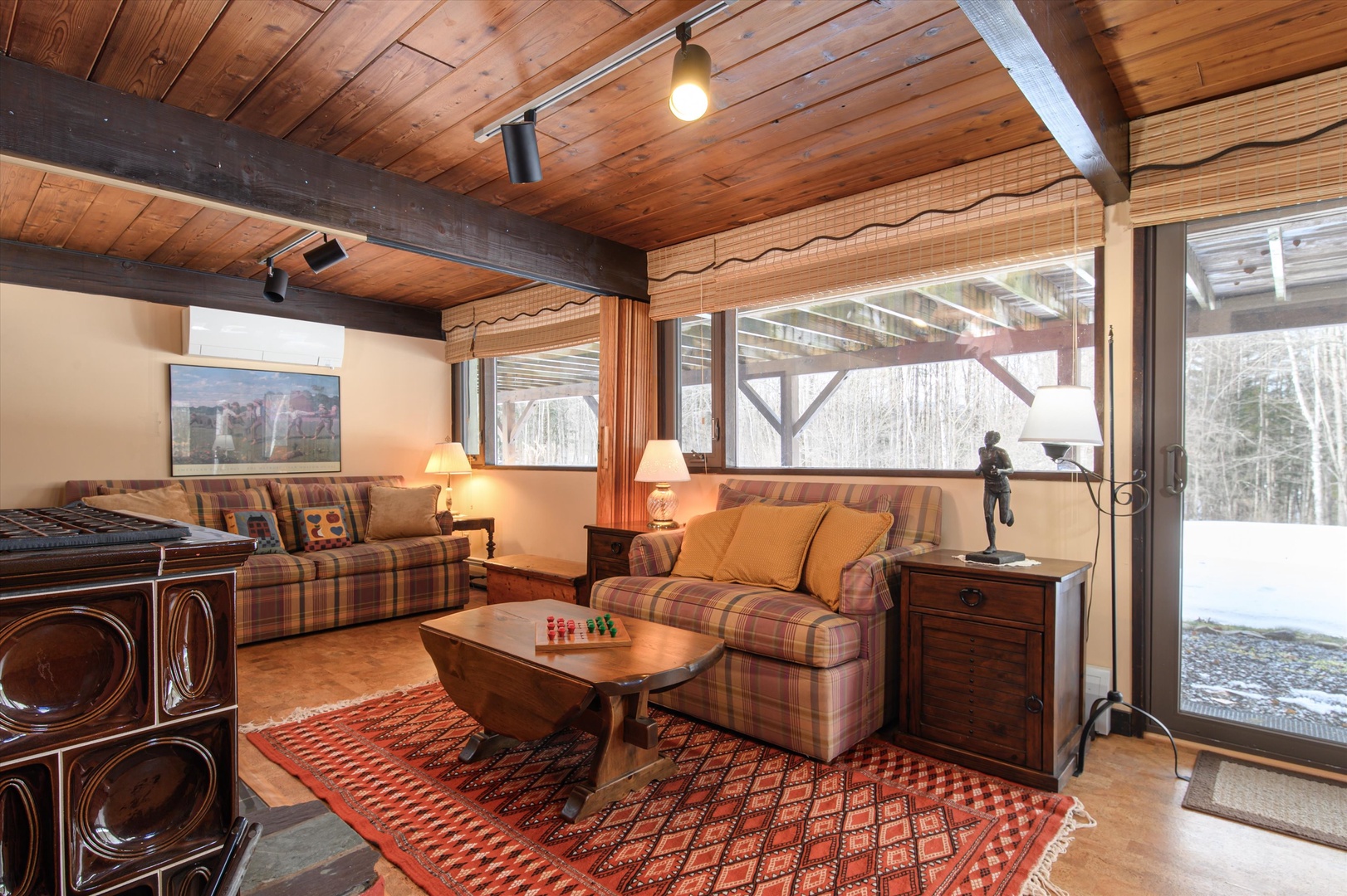 Retro-style basement retreat with plenty of seating and tv, a comfy spot to unwind.