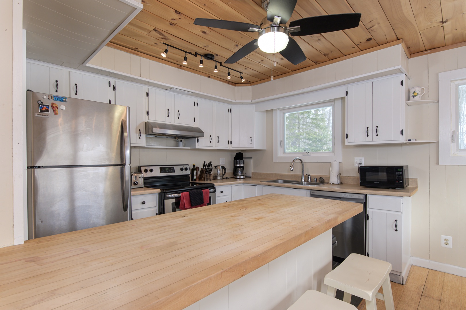 Your spacious kitchen features modern appliances and a large island perfect for cooking meals together during your stay.