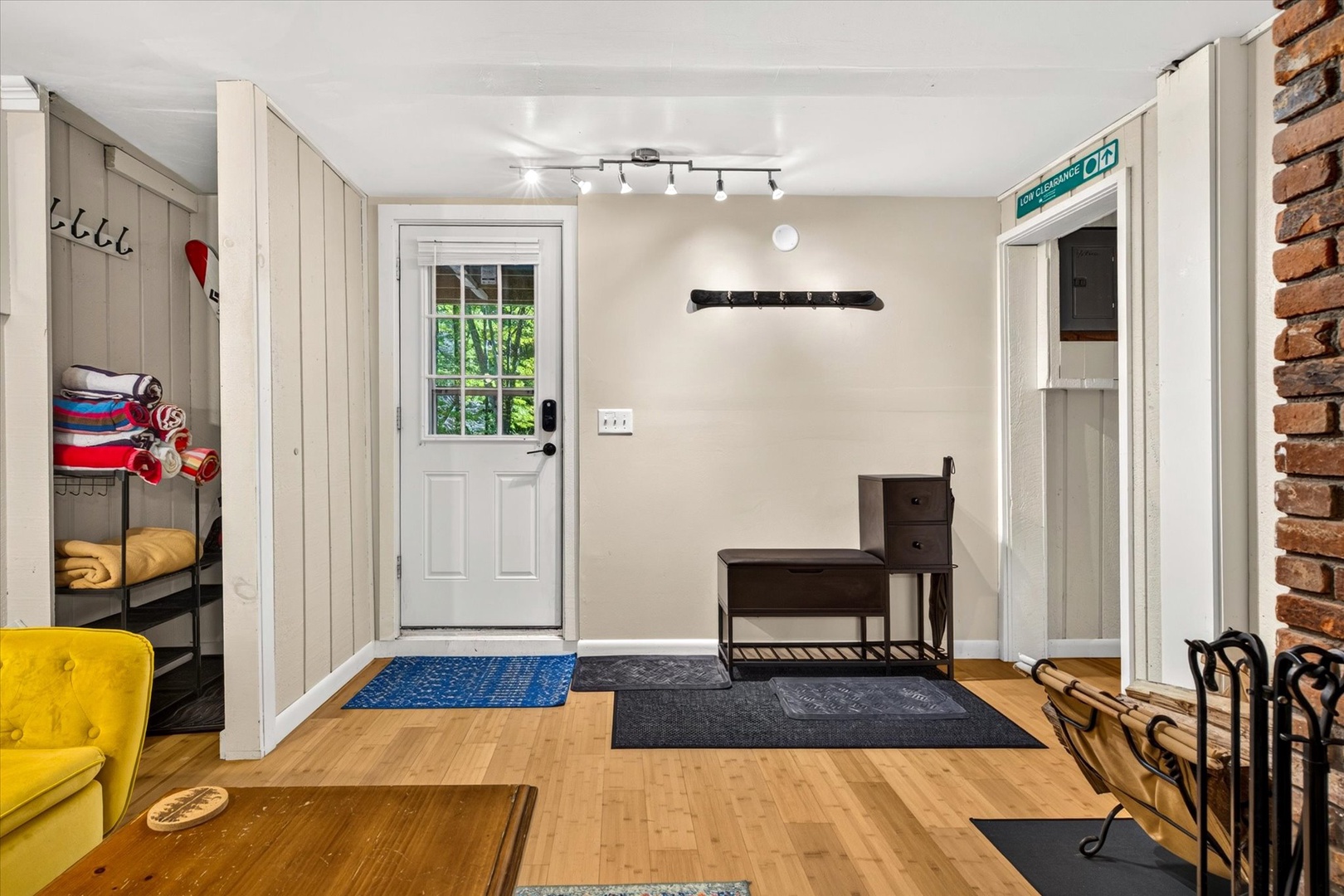 Step inside to a bright, welcoming entryway with warm wood floors and plenty of space to settle in after your adventures. The thoughtful mudroom keeps everything organized so you can focus on relaxation.