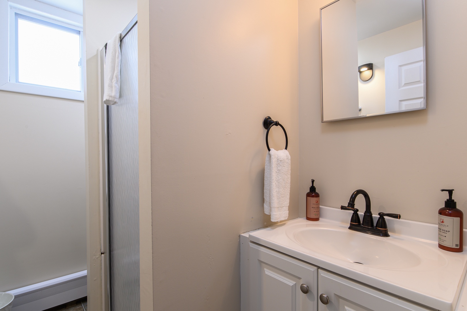 Refresh in your private bathroom with thoughtful touches—quality toiletries and plush towels await after your adventures.