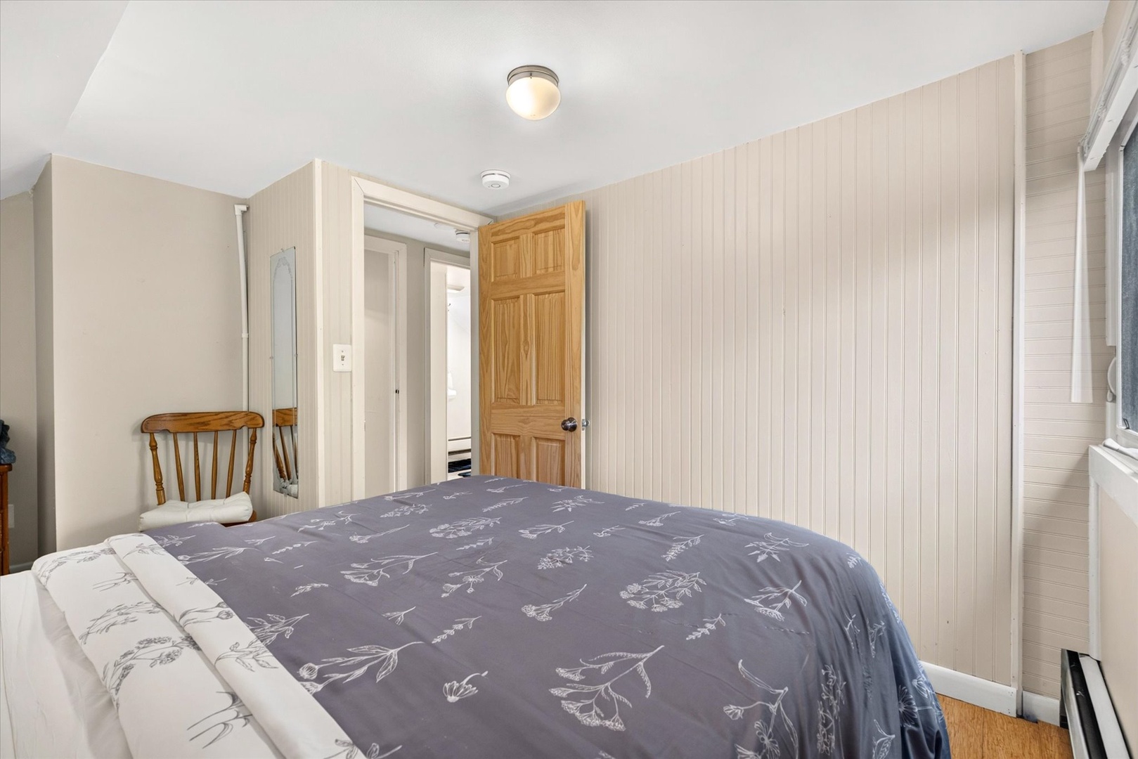 Rest easy in your cozy bedroom, complete with soft linens and warm cottage charm. A peaceful retreat awaits after your day of adventure.