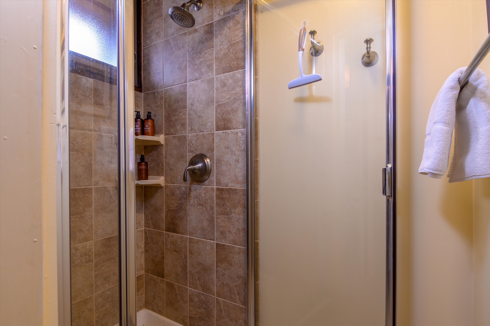 Lower-level bathroom with a shower, designed for a pleasant and easy routine to start and end your day.
