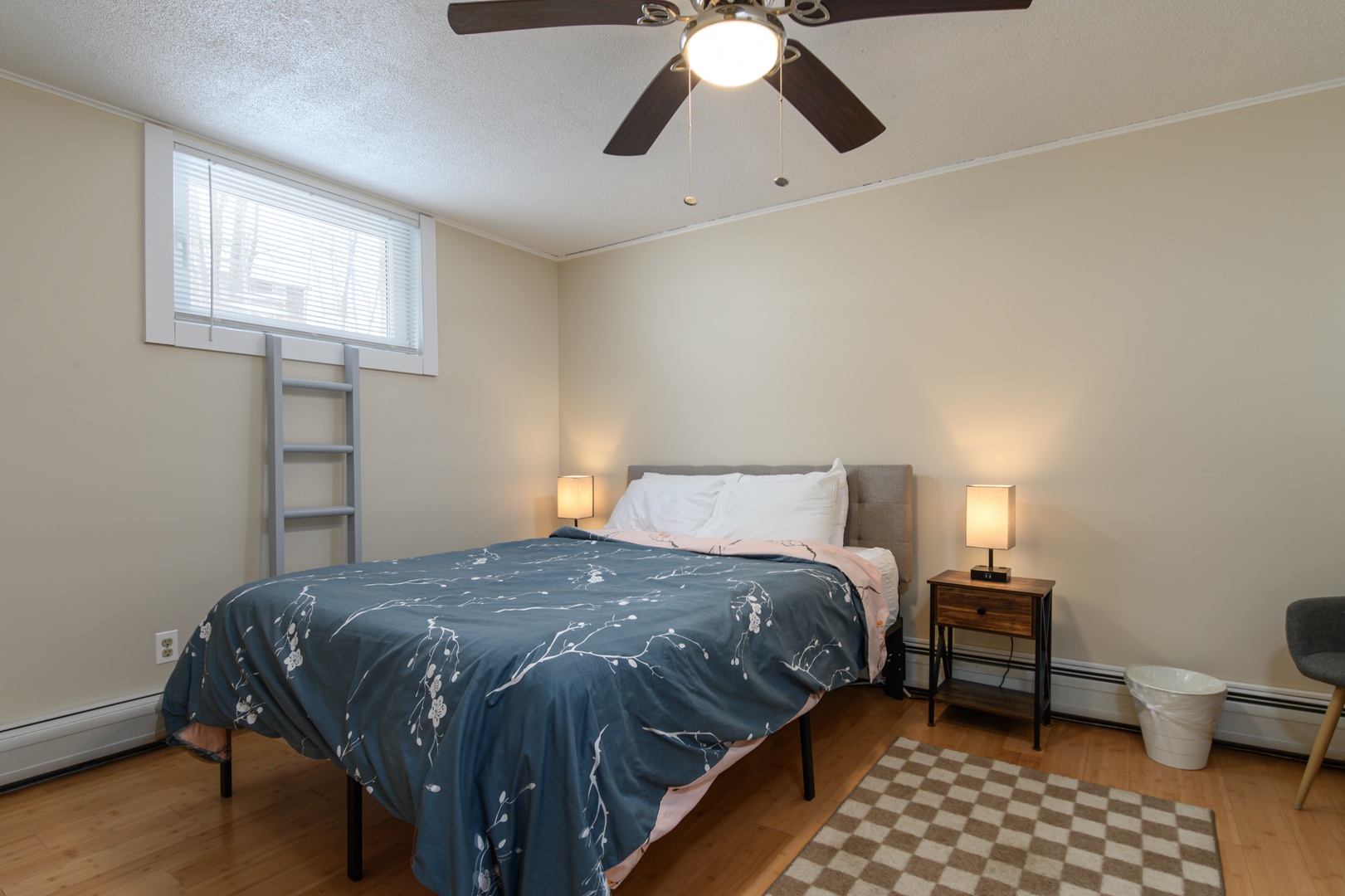 Comfortable queen bed in a welcoming bedroom, perfect for unwinding after a day with family or friends.