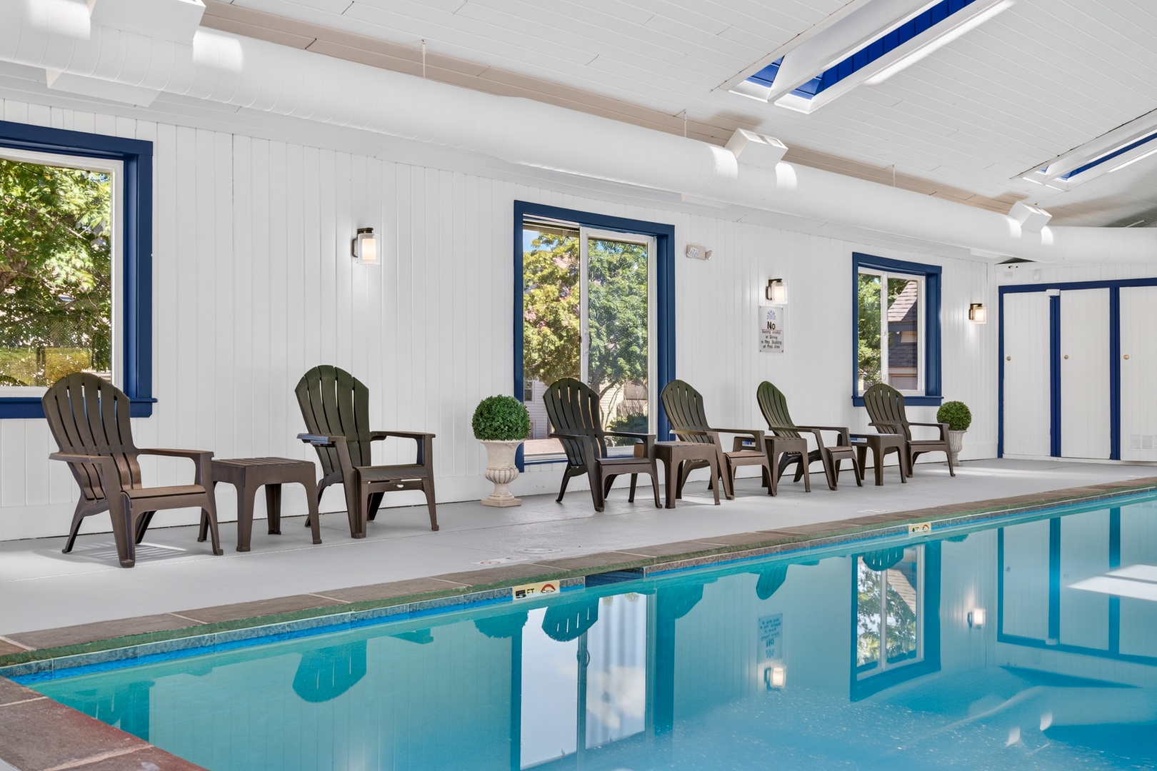 Sink into comfort by your private indoor pool, where bright skylights and a row of inviting lounge chairs set the scene for peaceful mornings or lazy afternoons.