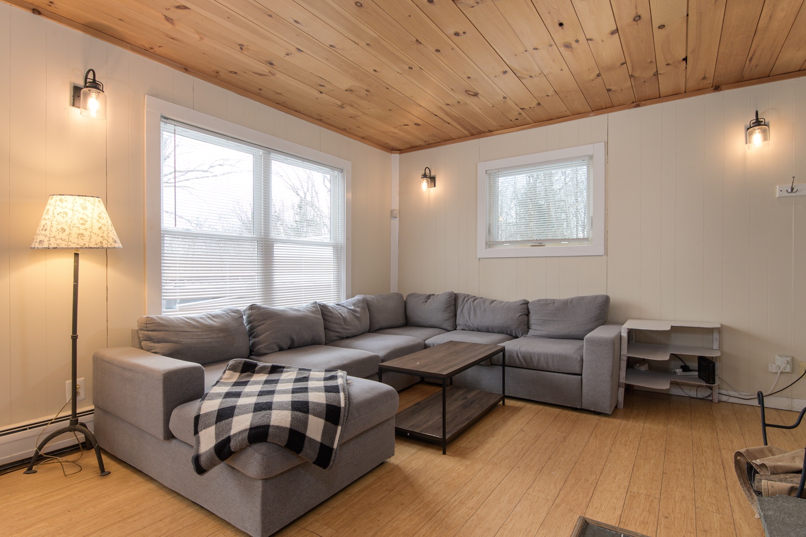 Curl up on the sectional, watch your favorite shows, cozy by the fireplace, and enjoy the sunlit open living space.