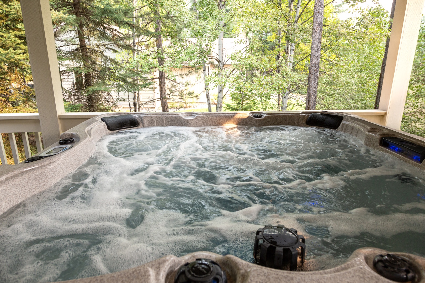 Slip into the bubbling hot tub on your private deck and let the soothing jets melt away tension as towering pines frame your peaceful forest retreat.