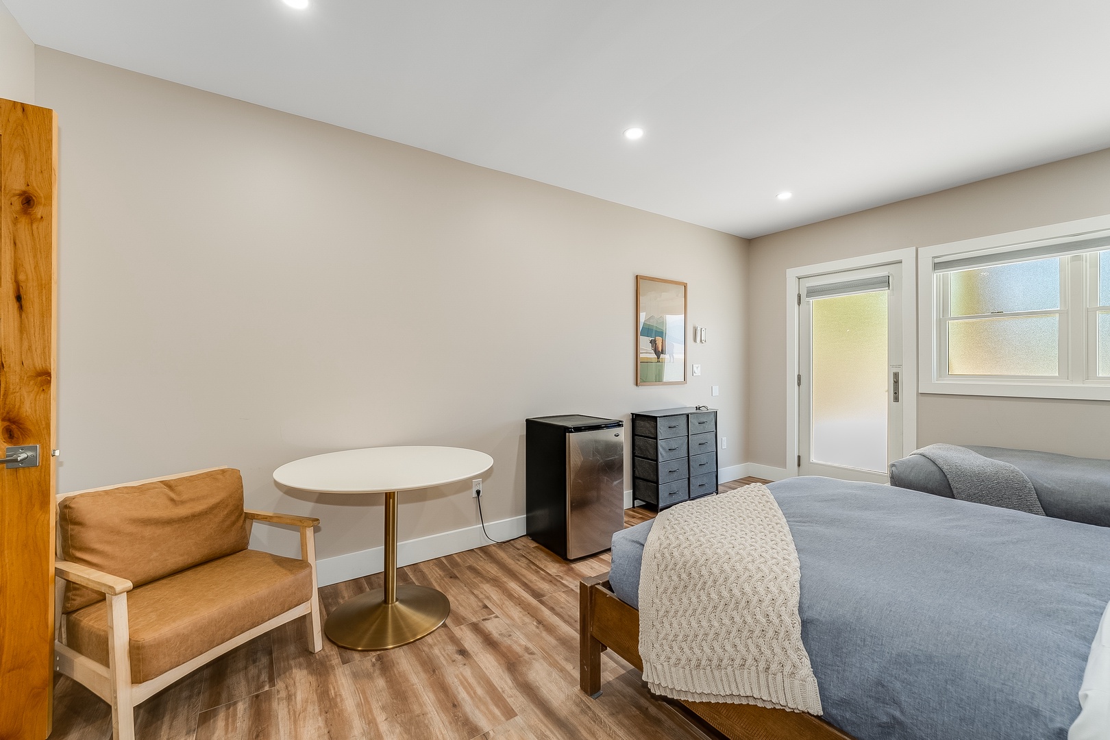 Your bright, comfortable bedroom awaits—settle in and enjoy the calm, clean space with modern comforts at your fingertips.