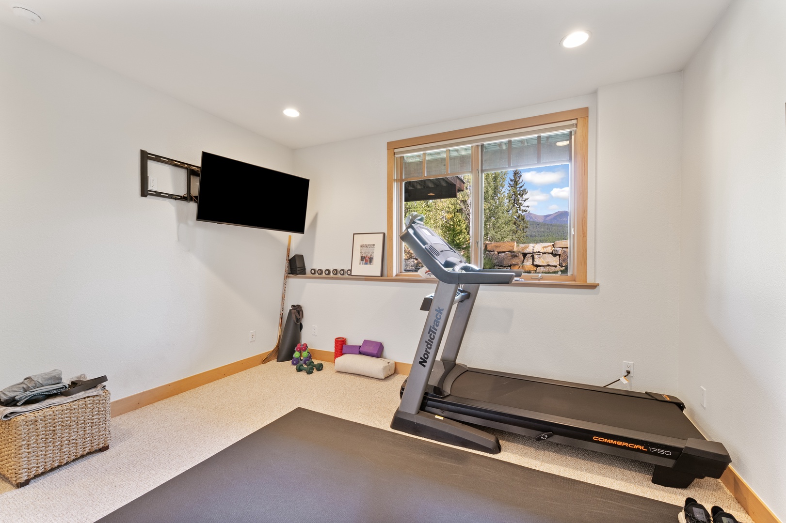 Stay active with your own private fitness space overlooking mountain views—stretch, run, and unwind in this peaceful workout room designed just for you.
