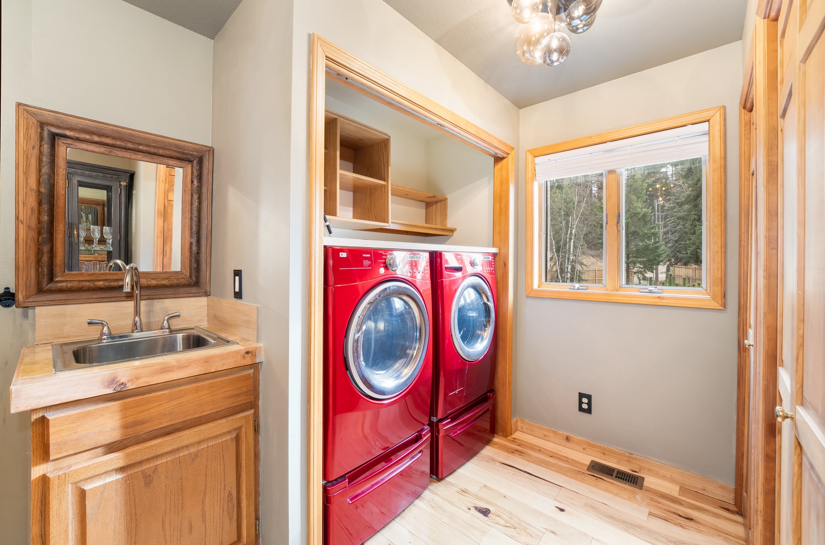 Your laundry room features modern appliances and a convenient sink, making it easy to keep your clothes fresh during your stay.