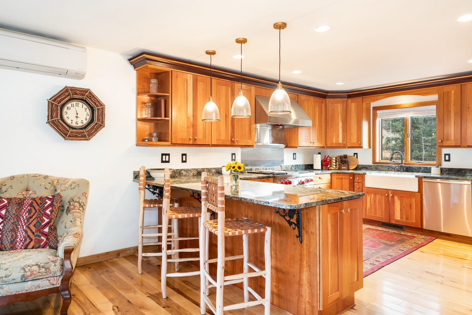 Your dream kitchen awaits with warm wood cabinets, granite countertops, and a cozy breakfast island where you'll savor morning coffee.