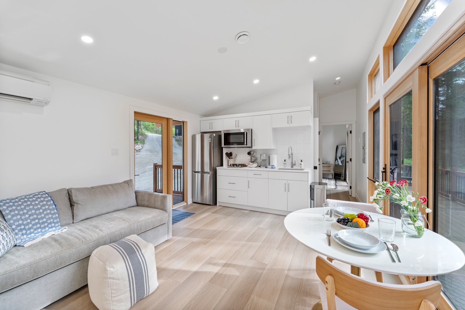 Relax in this bright, modern open-plan space where your fully equipped kitchen flows seamlessly into the cozy living area.