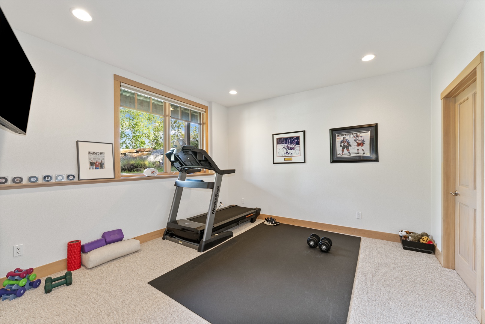 Your private fitness room is ready whenever you are, with a treadmill, weights, and yoga mat—perfect for keeping up with your routine or starting fresh in a bright, motivating space.