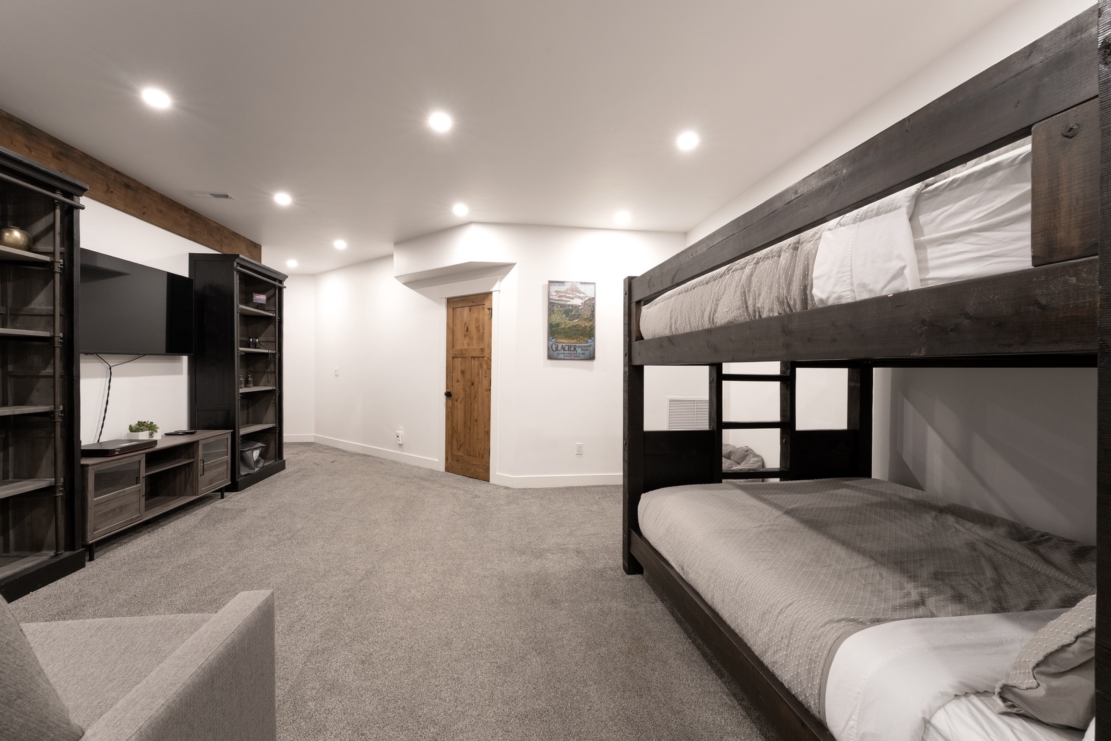 Unwind in your spacious bunk room with entertainment center, perfect for family fun and movie nights together.