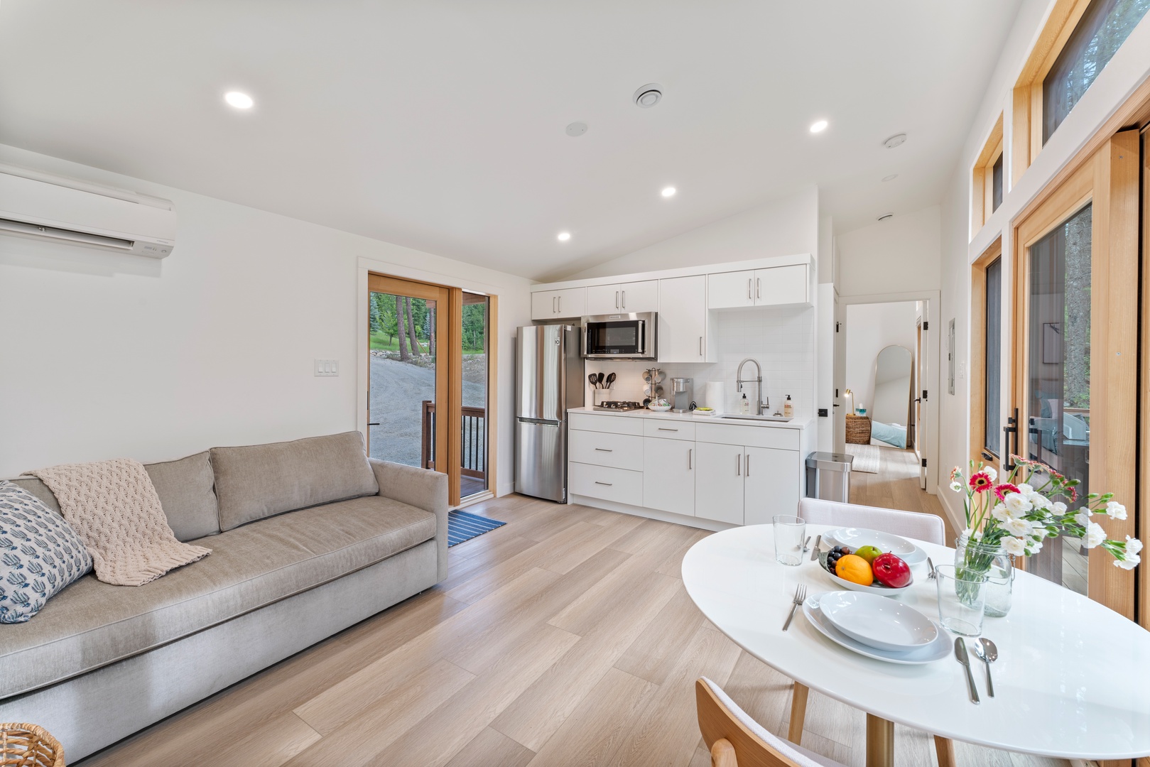 Your bright open-plan space seamlessly blends comfort and convenience, with a cozy living area flowing into your fully equipped kitchen.