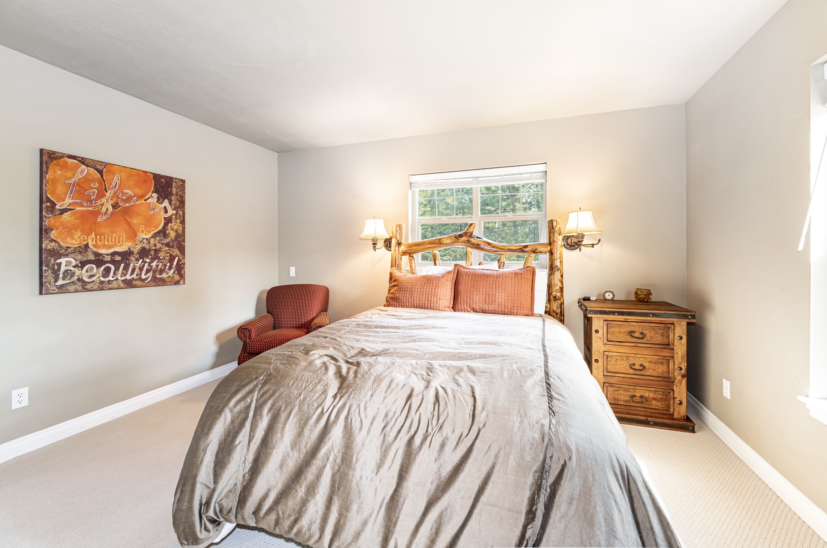 Your peaceful retreat features a cozy bed with rustic charm and soft lighting to help you unwind after a day of exploring.