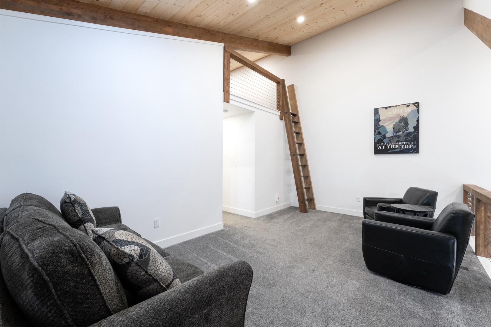 Your cozy loft retreat features plush seating and rustic wood beams, creating the perfect space to unwind after exploring.