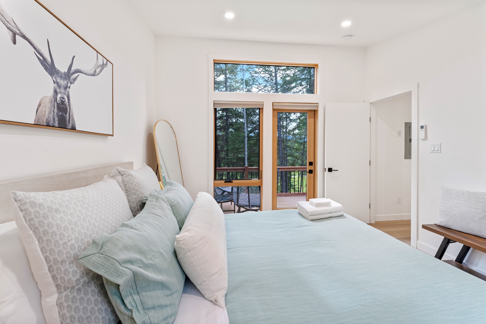 Wake to forest views and fresh air streaming through your private balcony doors. Soft linens and warm wood tones create a peaceful retreat where you'll rest deeply.