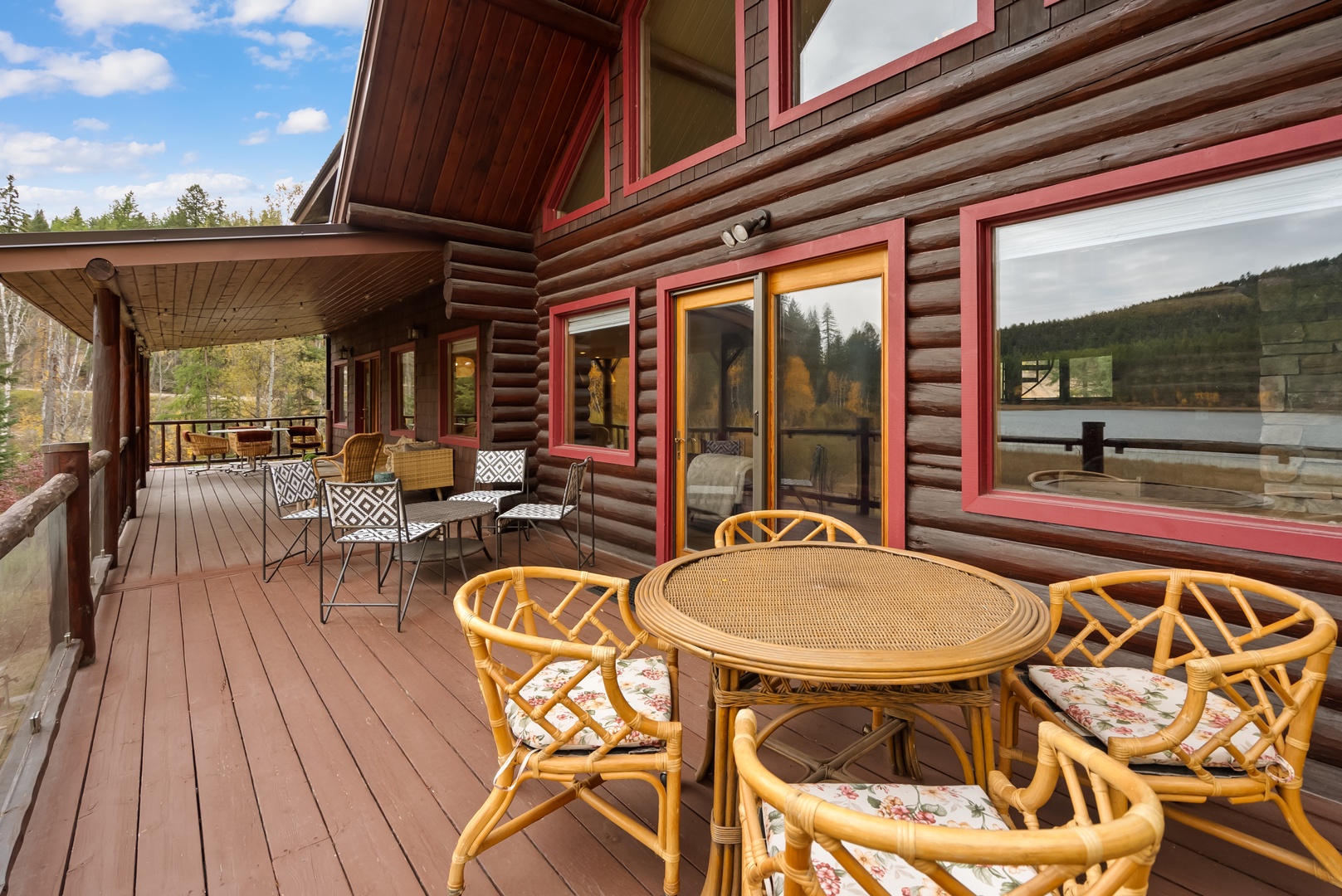 Relax on your private deck with mountain views, where cozy seating and peaceful forest surroundings create the perfect retreat.